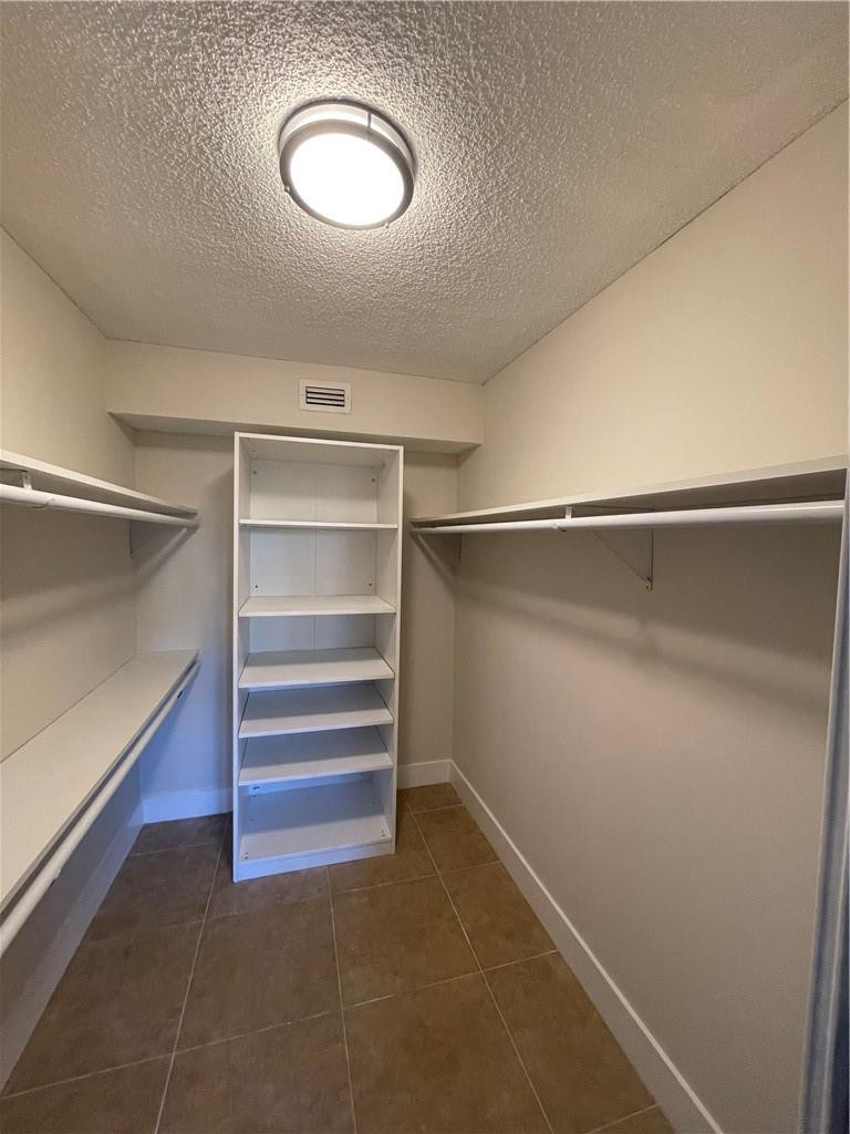 8801 Wiles Road, Unit 108 Coral Springs, FL 33067 - Photo 18 of 22 a view of a room with rack on the wall