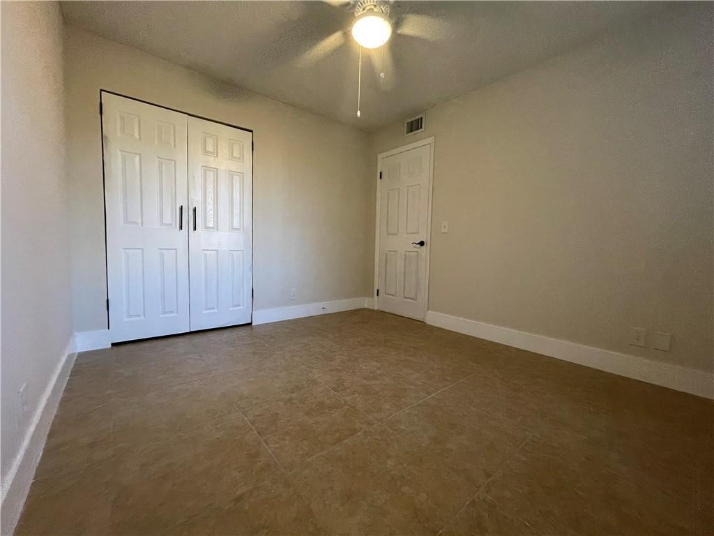 8801 Wiles Road, Unit 108 Coral Springs, FL 33067 - Photo 10 of 22 a view of an empty room with a window