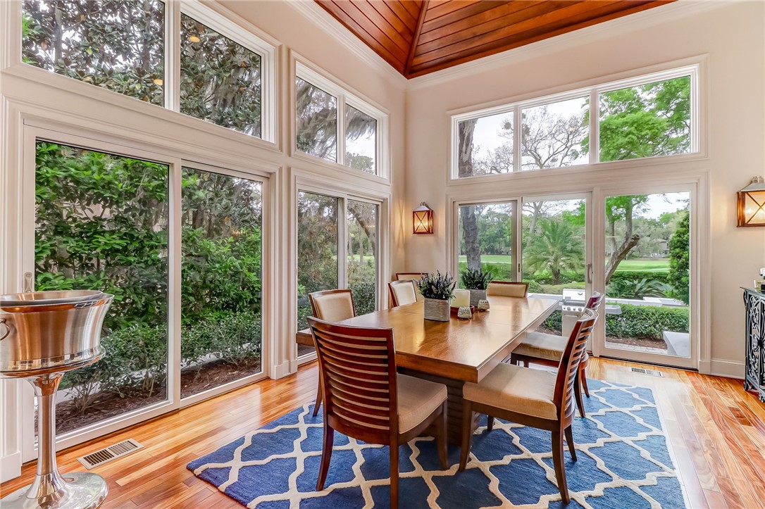 27 Sea Marsh Road Amelia Island, FL 32034 - Photo 5 of 10 a dining room with furniture and a floor to ceiling window
