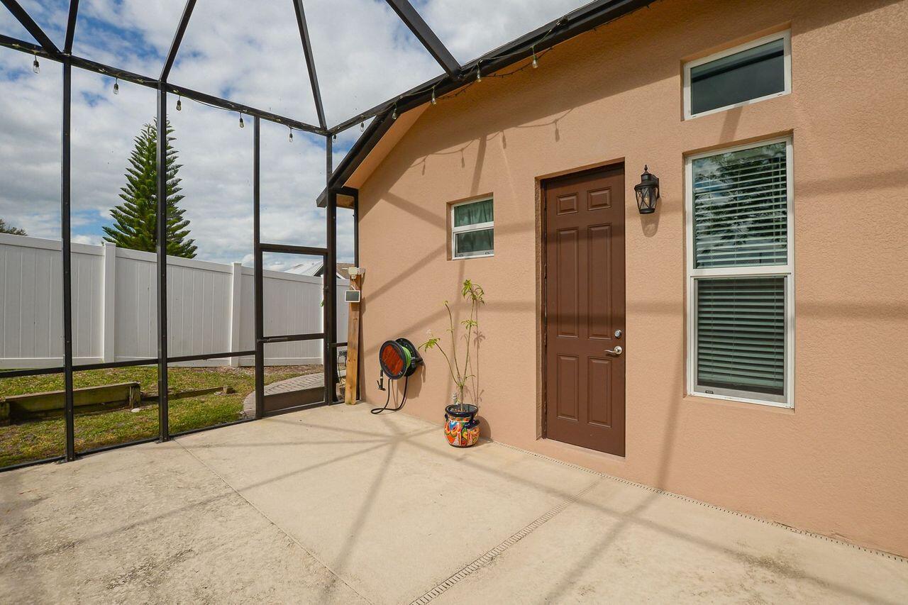 341 Southwest Kestor Drive, Unit 341 Port St. Lucie, FL 34953 - Photo 11 of 19 a view of a entryway door front of a house