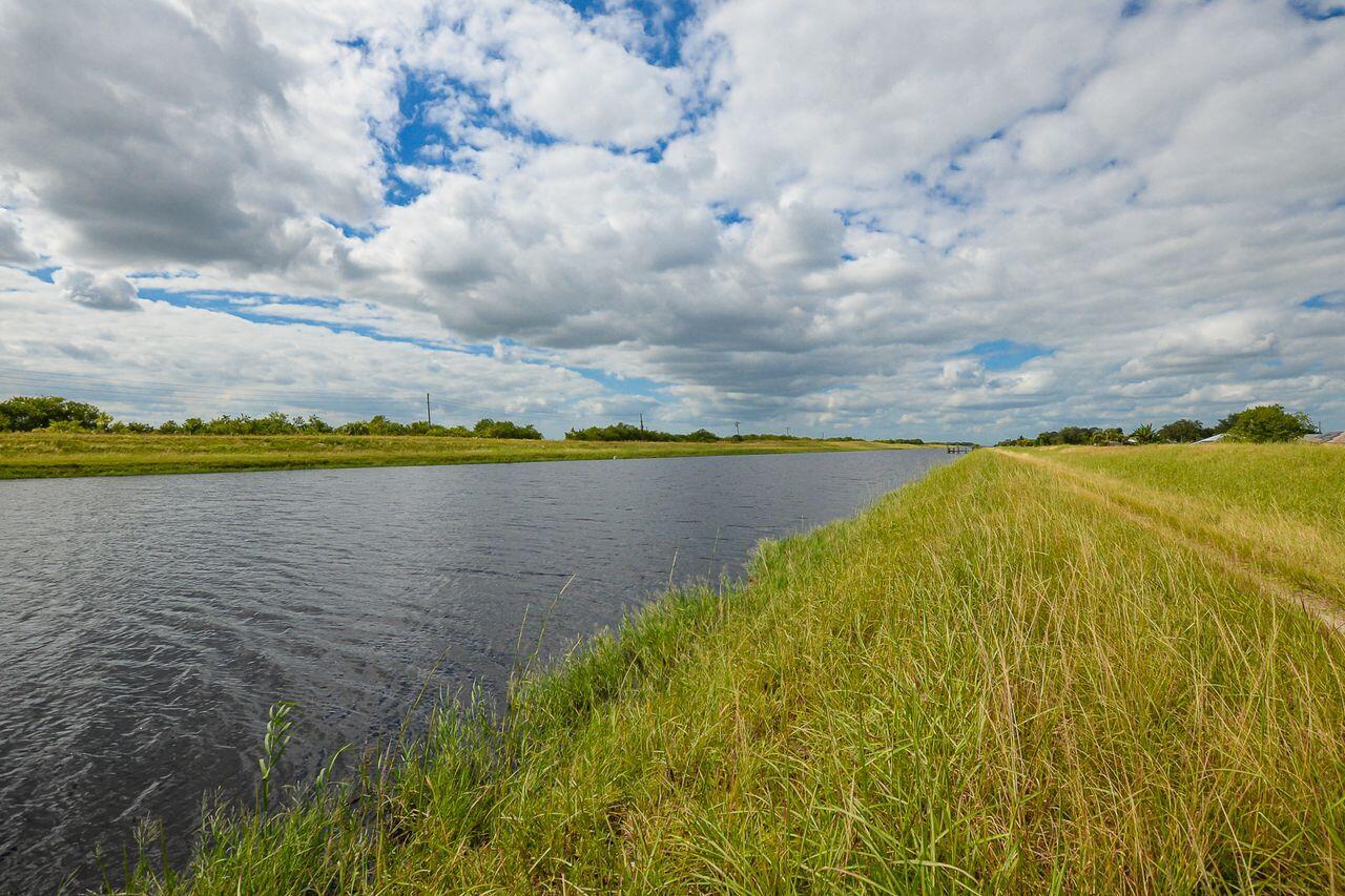 341 Southwest Kestor Drive, Unit 341 Port St. Lucie, FL 34953 - Photo 19 of 19 a view of an outdoor space and a lake view