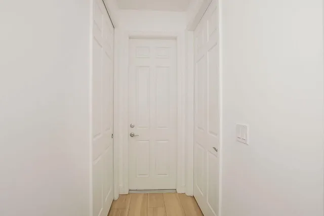 a view of a bedroom from the hallway