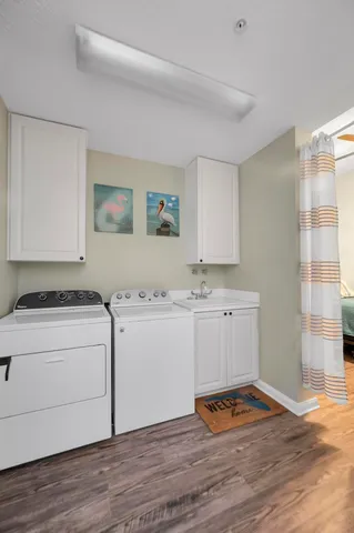 a room with a stove and wooden floor