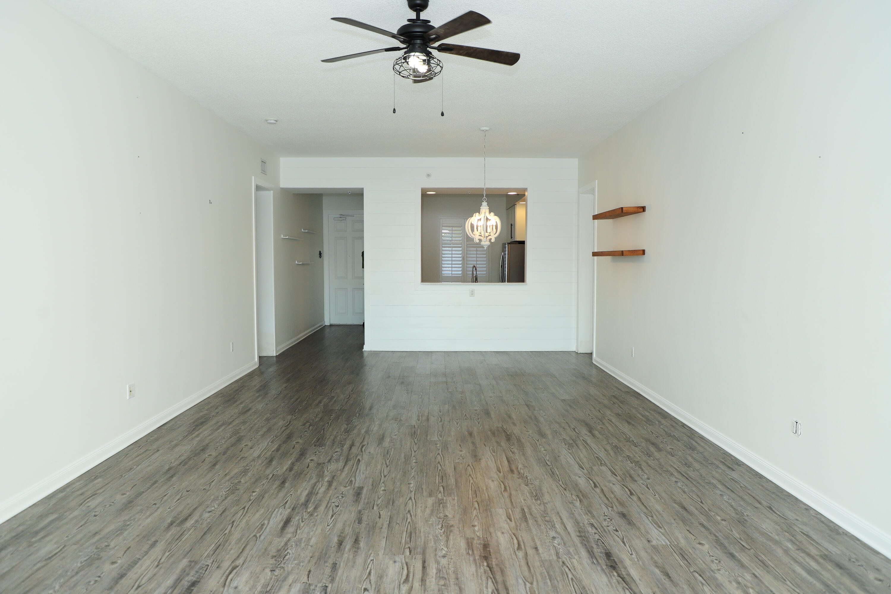 10 Harbour Isle Drive East, Unit 206 Fort Pierce, FL 34949 - Photo 6 of 12 a view of empty room with wooden floor
