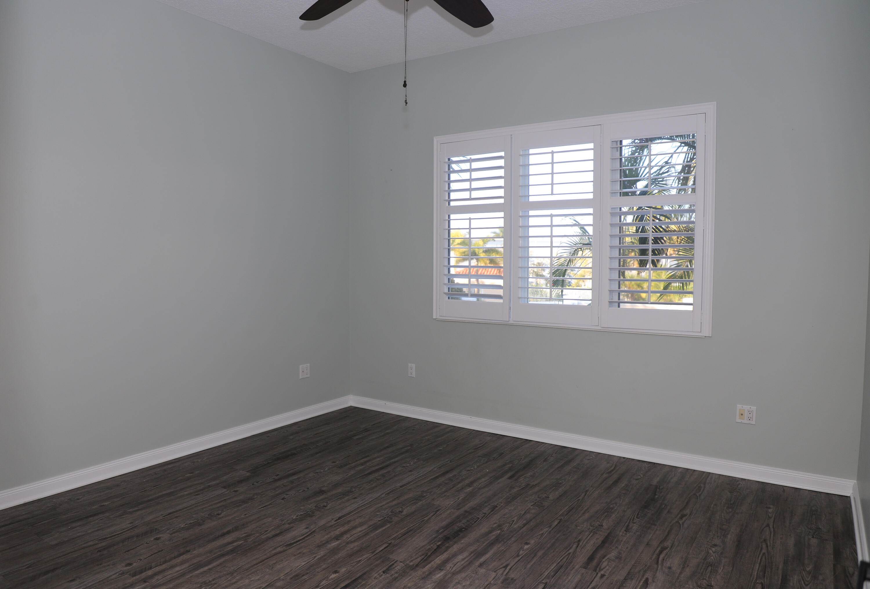 10 Harbour Isle Drive East, Unit 206 Fort Pierce, FL 34949 - Photo 8 of 12 a view of an empty room with wooden floor and a window