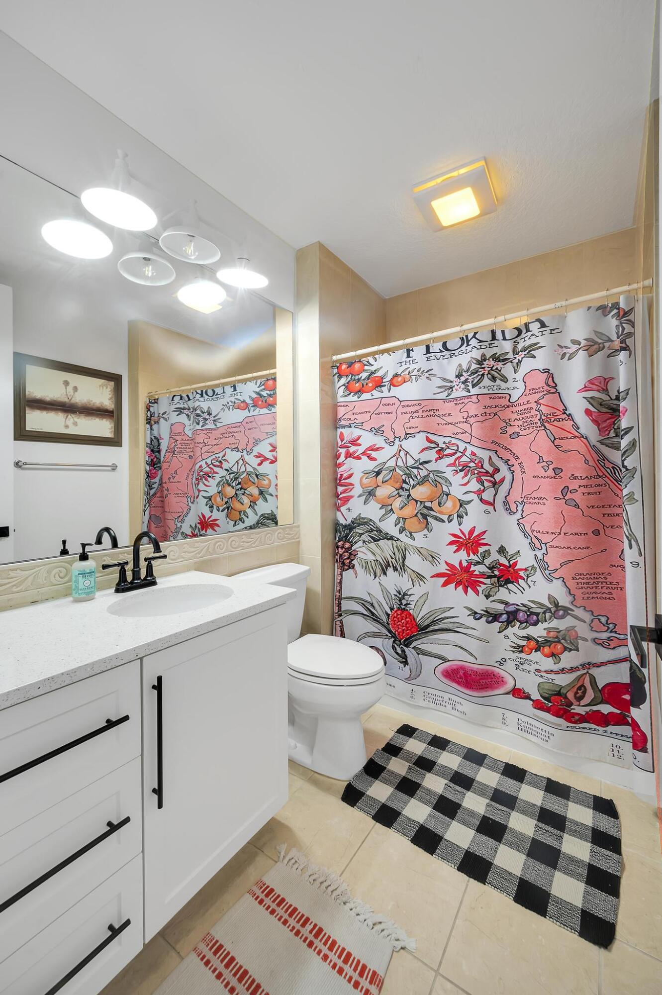 10 Harbour Isle Drive East, Unit 206 Fort Pierce, FL 34949 - Photo 10 of 12 a room with painting on the wall and a rug