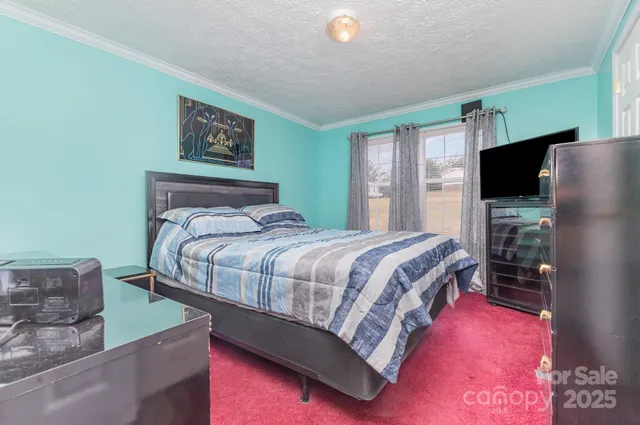 a bathroom with a sink a toilet and shower curtain