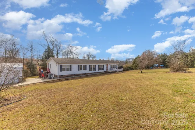 a view of a yard with trees