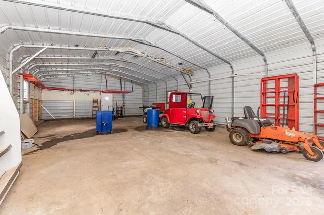a view of a garage with cars