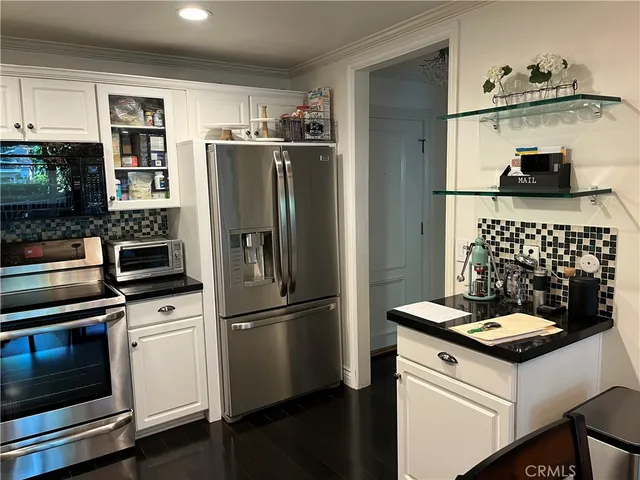 a view of a chair and table in the balcony