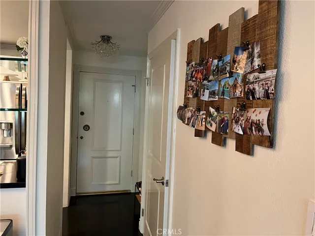 a bedroom with a bed a mirror and a window