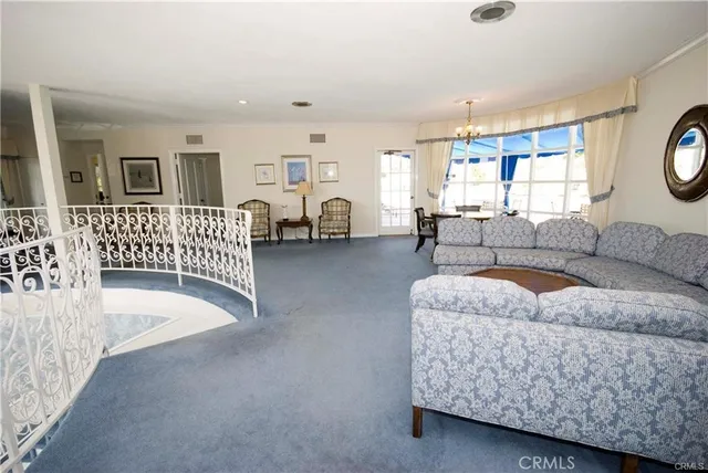 a view of a swimming pool with outdoor seating space