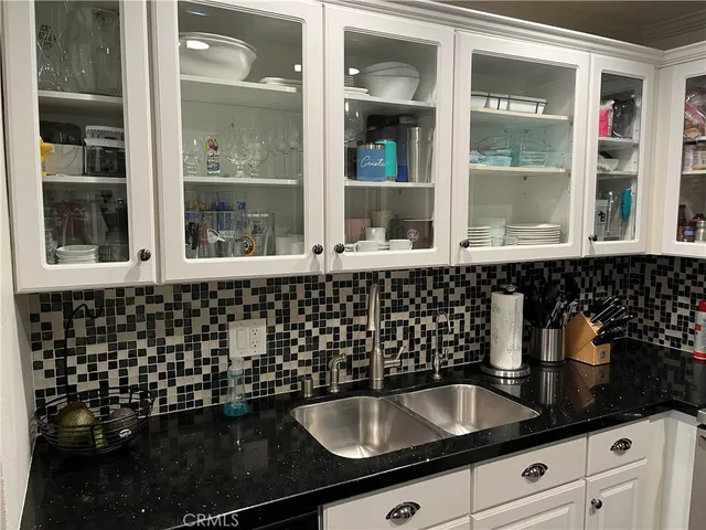 a kitchen with a sink and a window