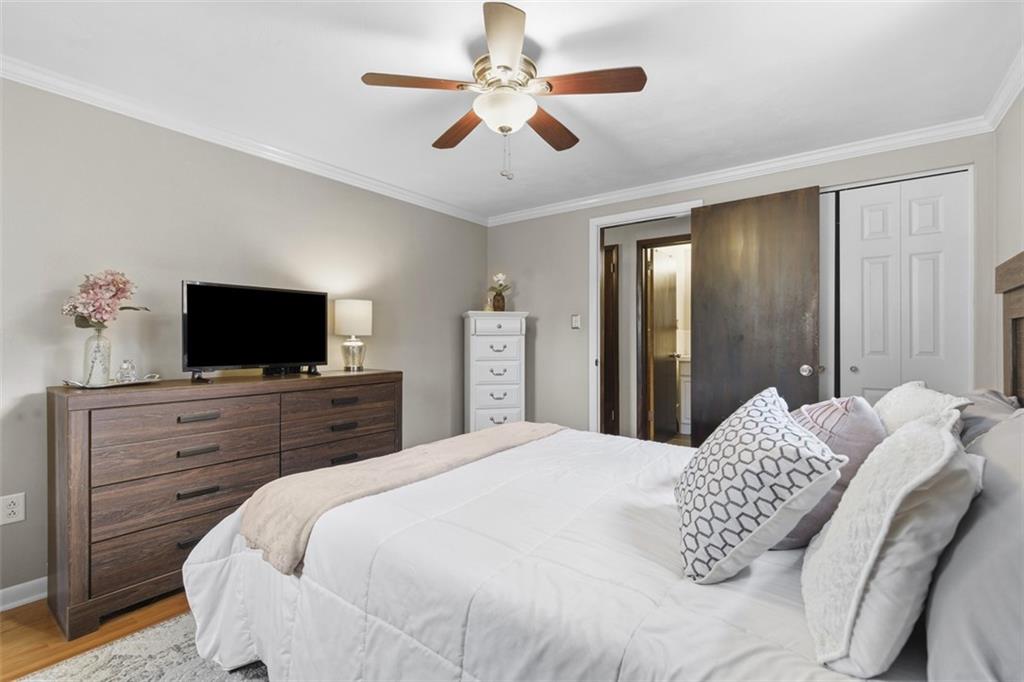 301 Amity Road Glenshaw, PA 15116 - Photo 11 of 30 a bedroom with a bed and a flat screen tv