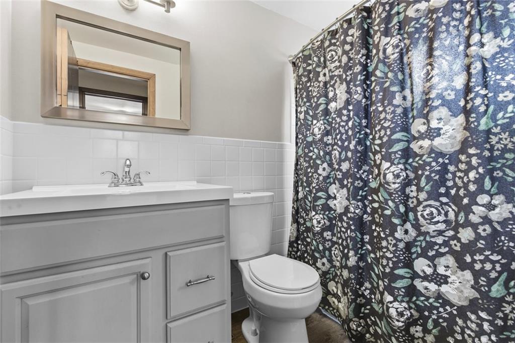 301 Amity Road Glenshaw, PA 15116 - Photo 12 of 30 a bathroom with a sink toilet and a mirror