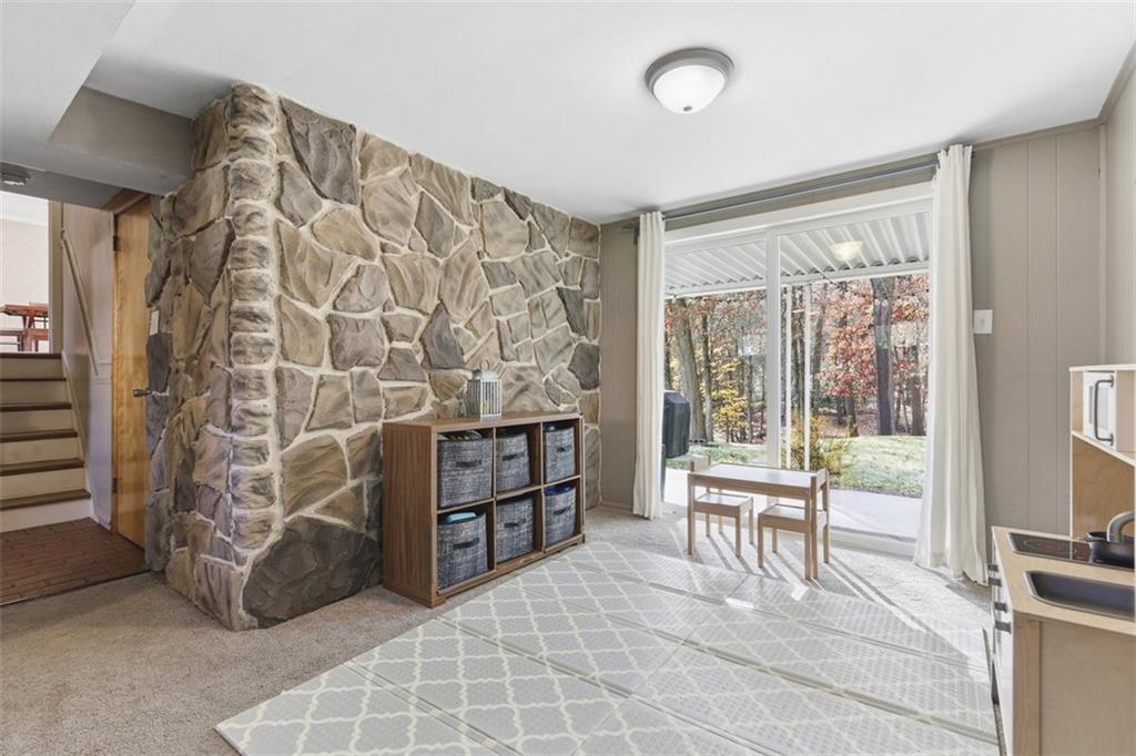301 Amity Road Glenshaw, PA 15116 - Photo 17 of 30 a living room with furniture a lamp and a large window