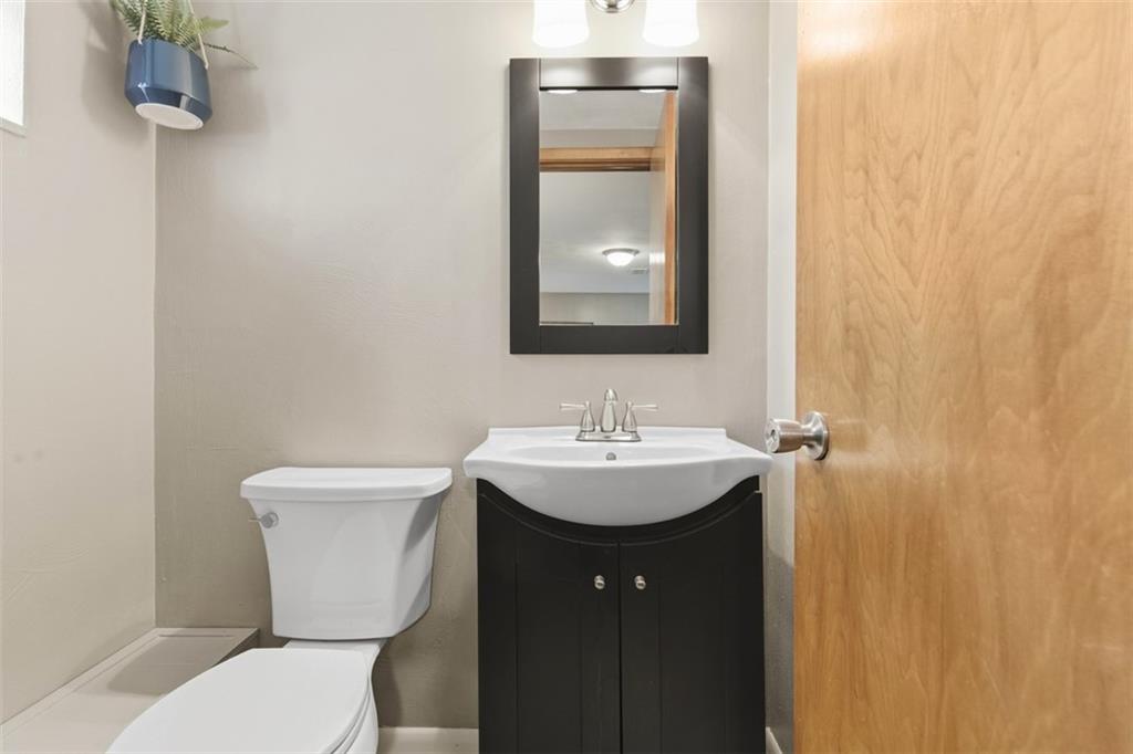 301 Amity Road Glenshaw, PA 15116 - Photo 19 of 30 a bathroom with a toilet sink and mirror