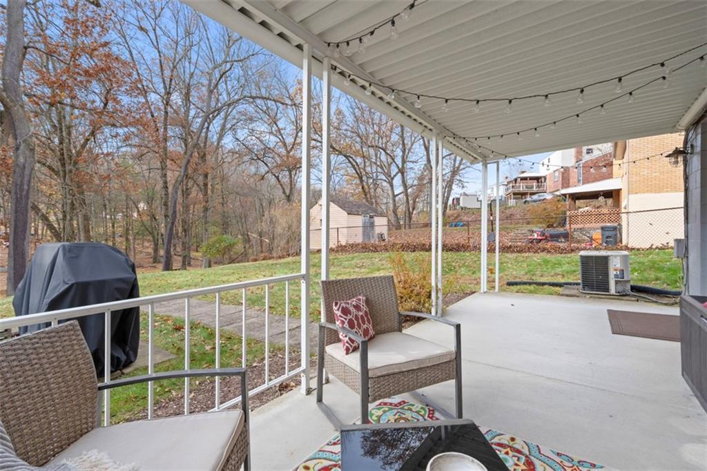 301 Amity Road Glenshaw, PA 15116 - Photo 20 of 30 a view of a porch with furniture and a backyard