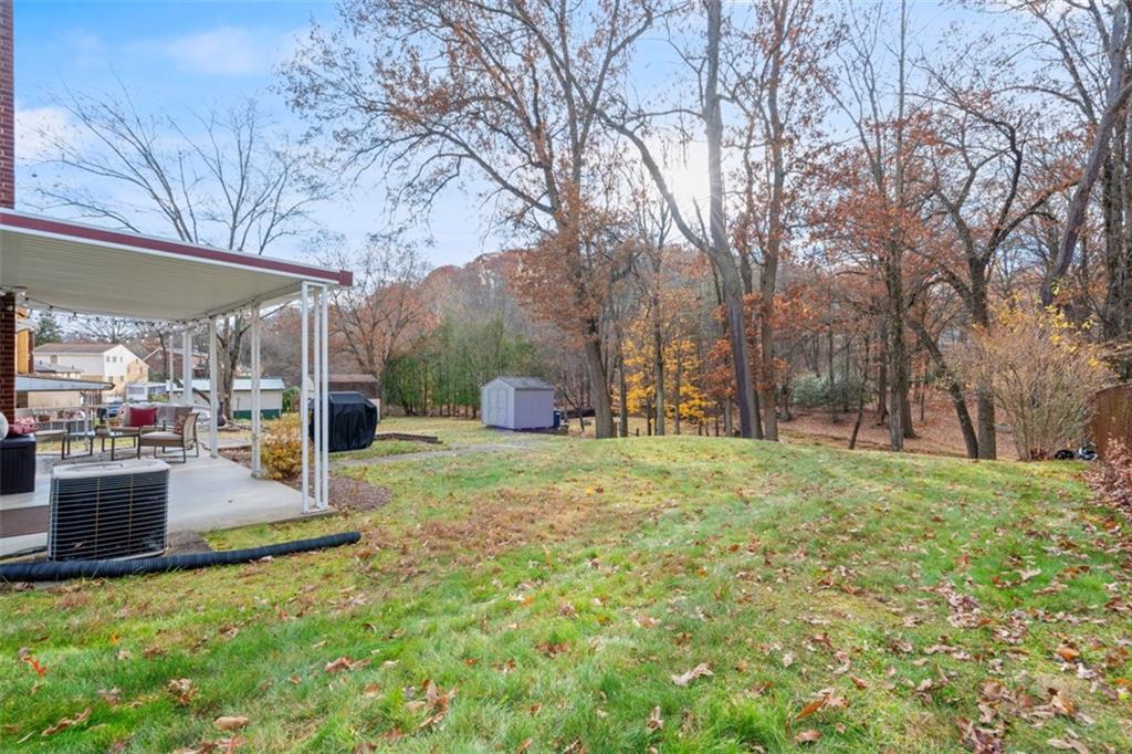 301 Amity Road Glenshaw, PA 15116 - Photo 22 of 30 a view of a backyard with large tree