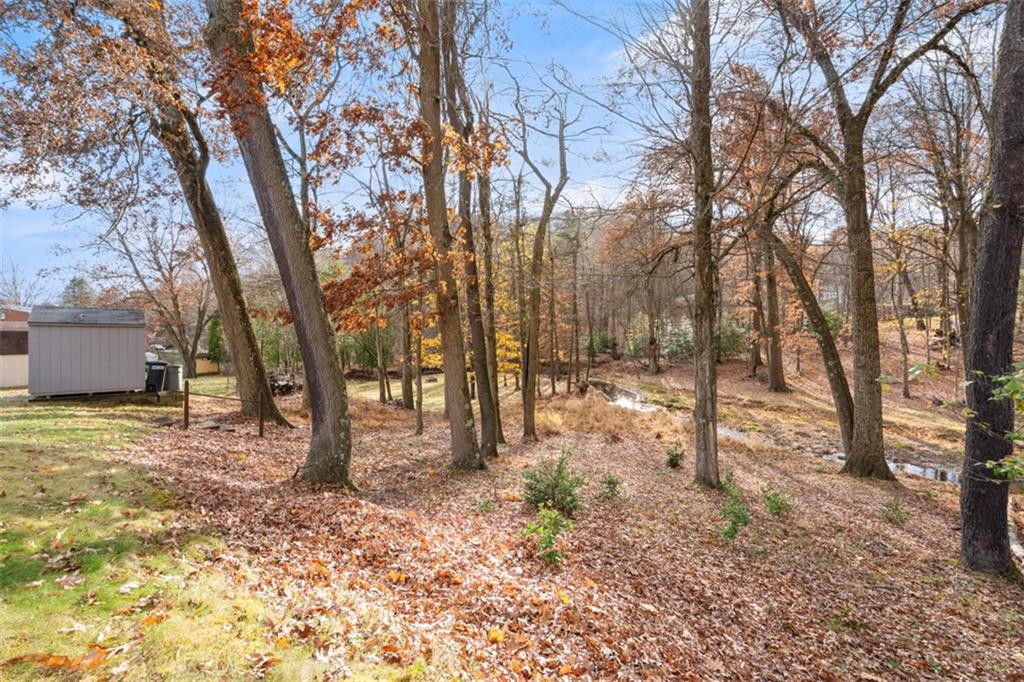 301 Amity Road Glenshaw, PA 15116 - Photo 25 of 30 a backyard of a house with trees