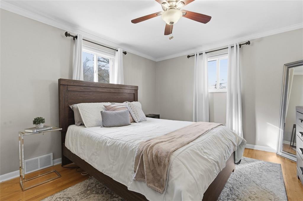 301 Amity Road Glenshaw, PA 15116 - Photo 10 of 30 a bedroom with a large bed and a chandelier