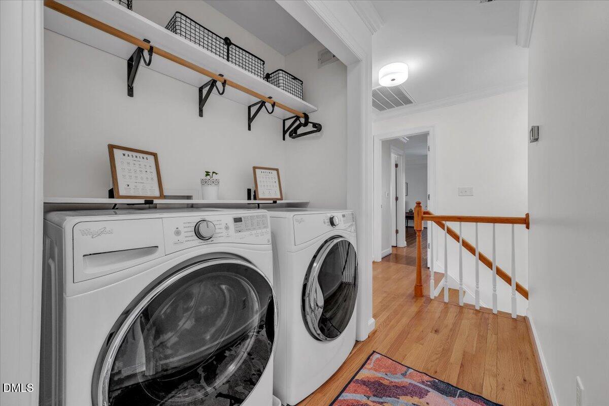 2908 Oak Bridge Drive Raleigh, NC 27610 - Photo 30 of 47 a view of a hallway with washer and dryer