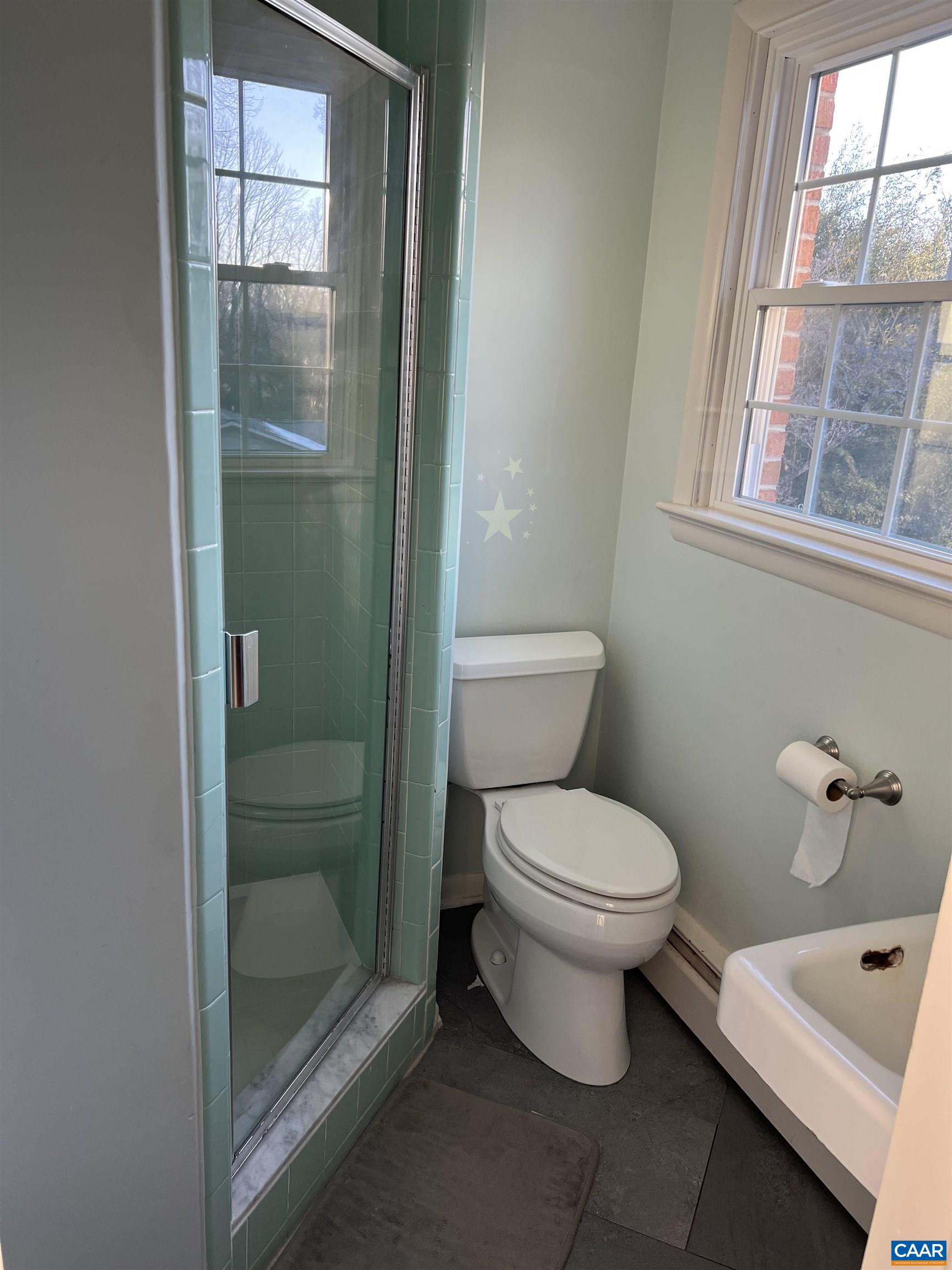 206 Georgetown Road Charlottesville, VA 22901 - Photo 14 of 35 a white toilet sitting next to a bathroom next to a window