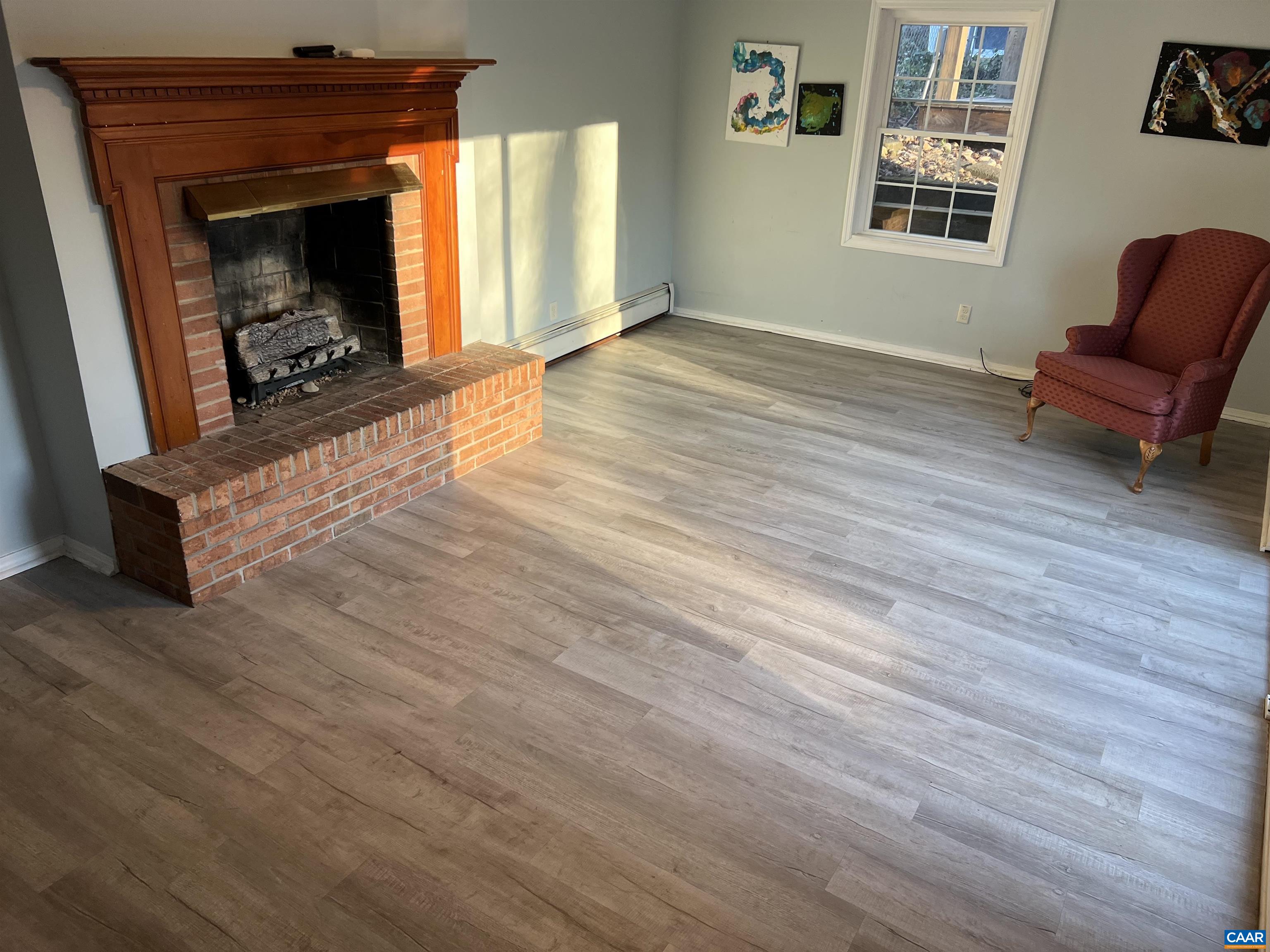 206 Georgetown Road Charlottesville, VA 22901 - Photo 18 of 35 a living room with furniture and a fireplace