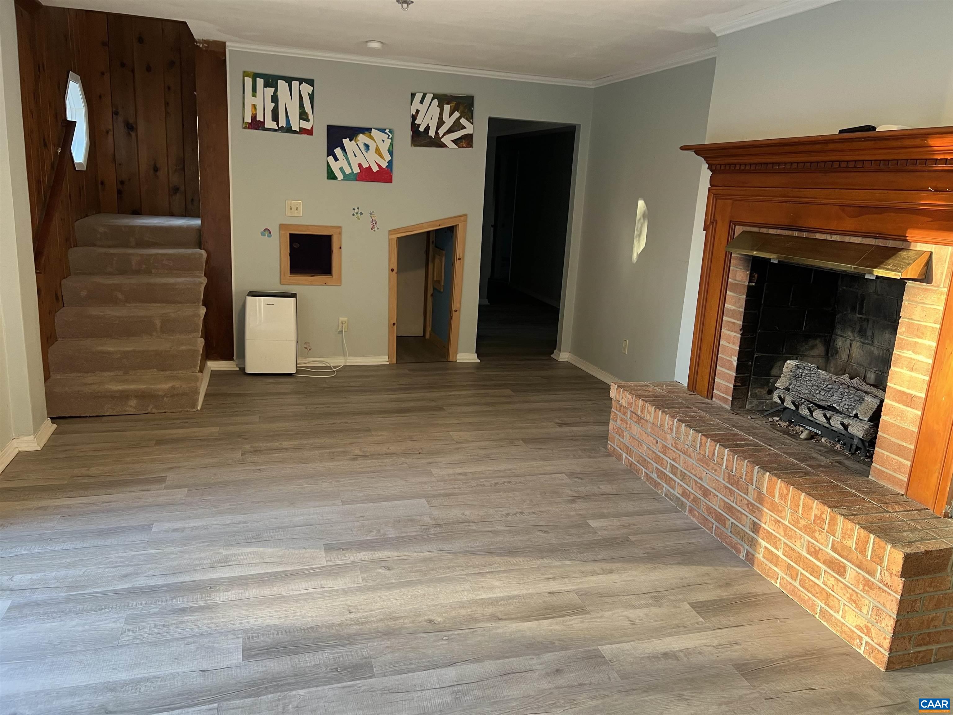 206 Georgetown Road Charlottesville, VA 22901 - Photo 19 of 35 a view of a hallway with wooden floor and a fireplace