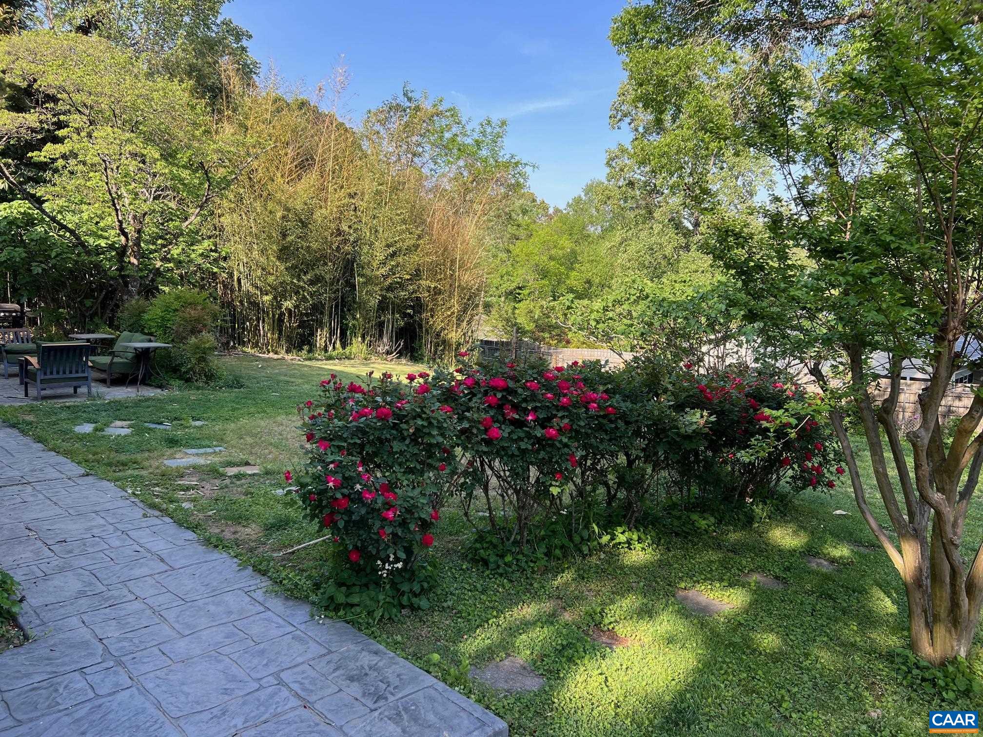206 Georgetown Road Charlottesville, VA 22901 - Photo 2 of 35 a view of a garden with flowers and trees