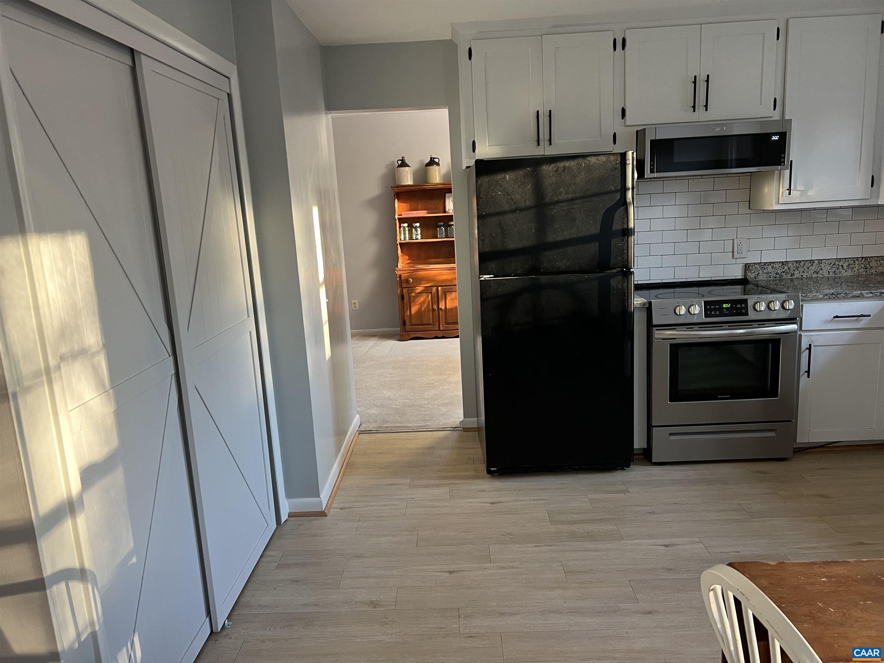206 Georgetown Road Charlottesville, VA 22901 - Photo 6 of 35 a kitchen with stainless steel appliances granite countertop a refrigerator and a sink