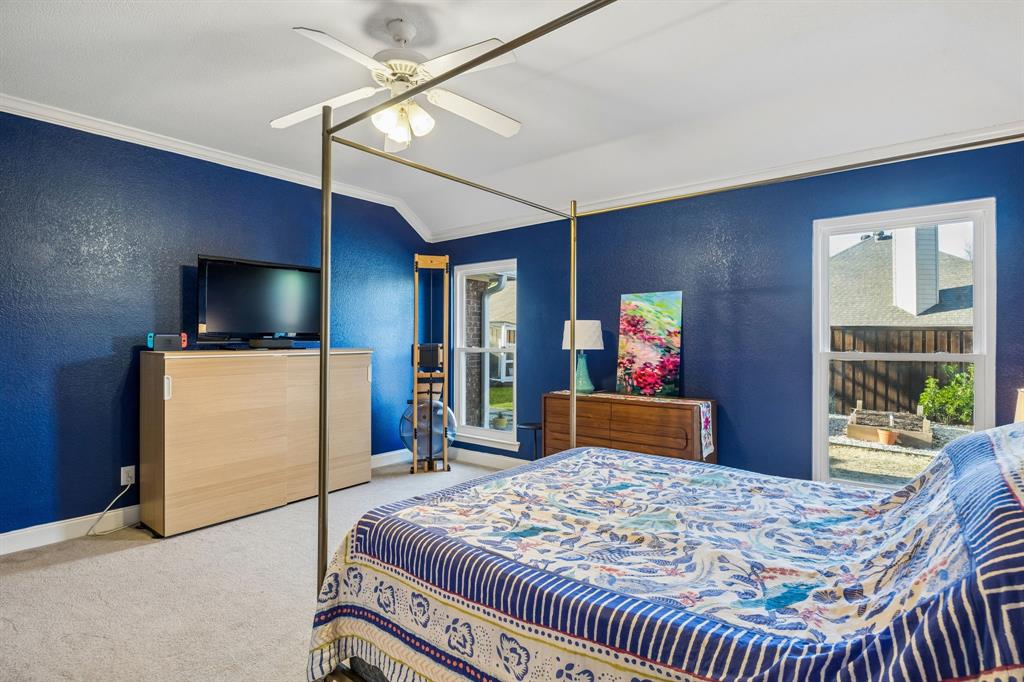 12404 Ark Road Frisco, TX 75035 - Photo 15 of 28 a bedroom with a bed and wooden floor