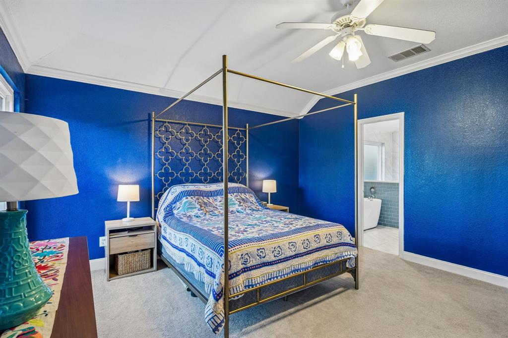 12404 Ark Road Frisco, TX 75035 - Photo 16 of 28 a bedroom with a bed and a ceiling fan