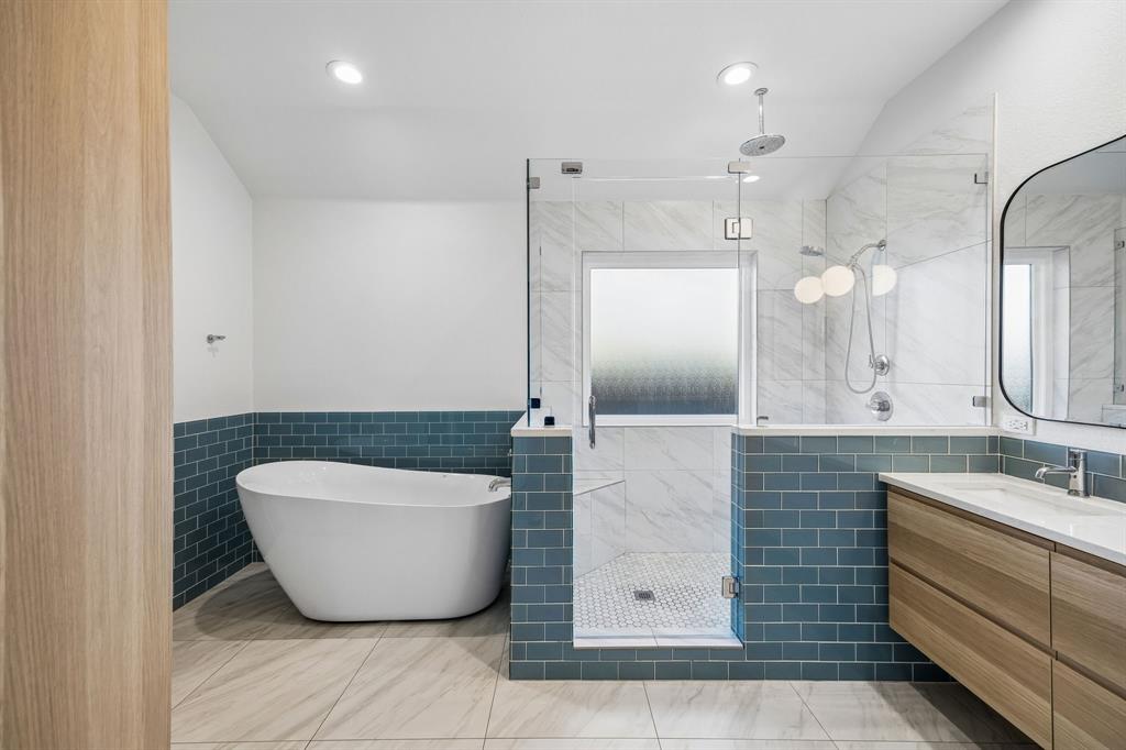 12404 Ark Road Frisco, TX 75035 - Photo 19 of 28 a bathroom with a double vanity sink a mirror and shower