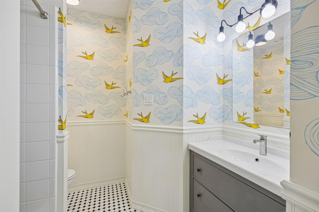 12404 Ark Road Frisco, TX 75035 - Photo 21 of 28 a bathroom with a sink and a shower