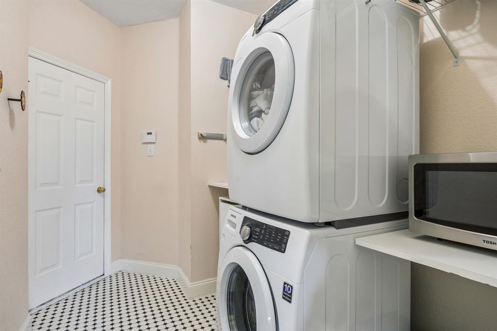 12404 Ark Road Frisco, TX 75035 - Photo 23 of 28 a utility room with dryer and washer