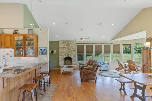 a living room with furniture stove and a fireplace