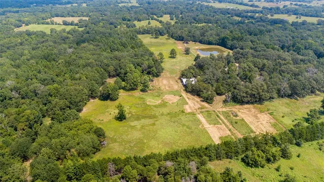 a view of a swimming pool and mountains in the background