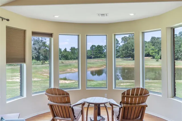 a view of a city from a dining room with furniture window and outside view