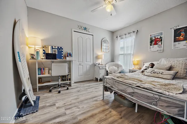 a bedroom with bed and a window