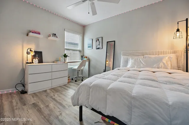 a bed room with a bed and a desk