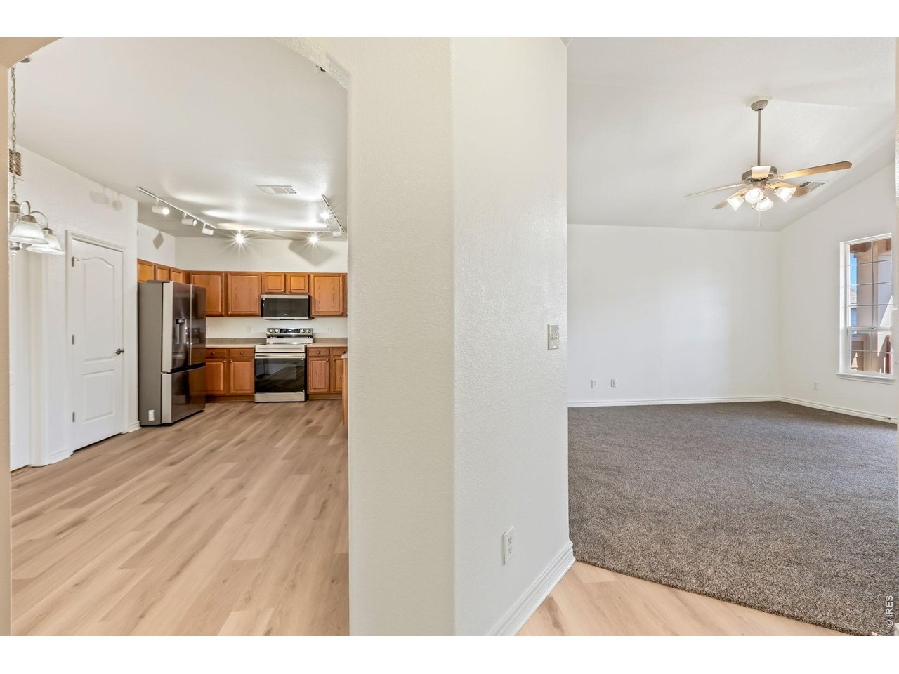 4672 West 20th Road, Unit 2323 Greeley, CO 80634 - Photo 16 of 34 Kitchen opens up to living area