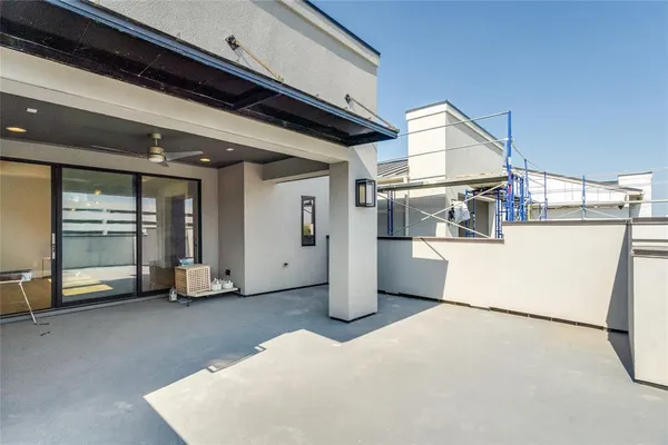a view of a swimming pool with outdoor seating and plants