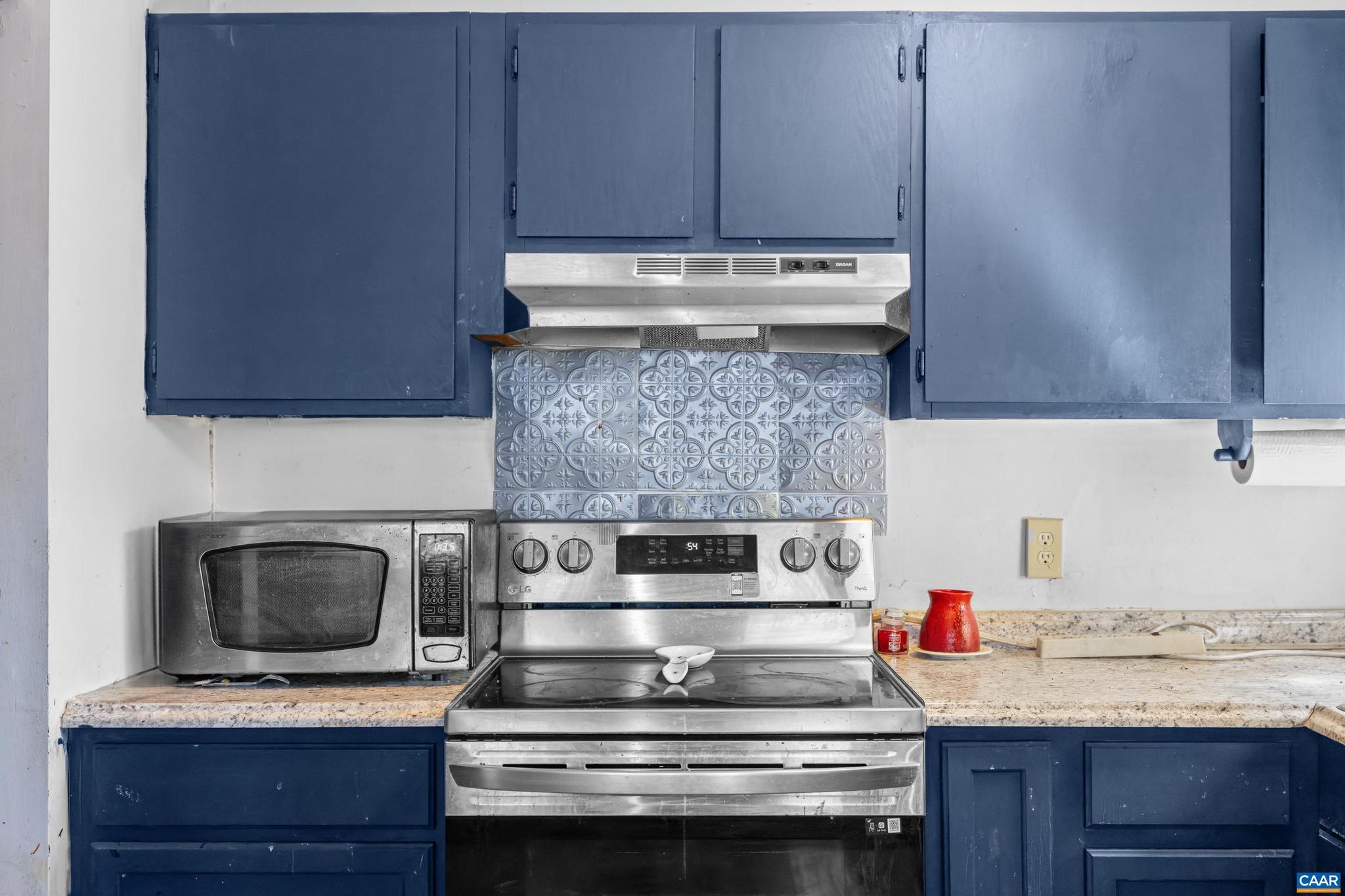215 Dice Street Charlottesville, VA 22902 - Photo 17 of 52 a kitchen with a stove and a microwave