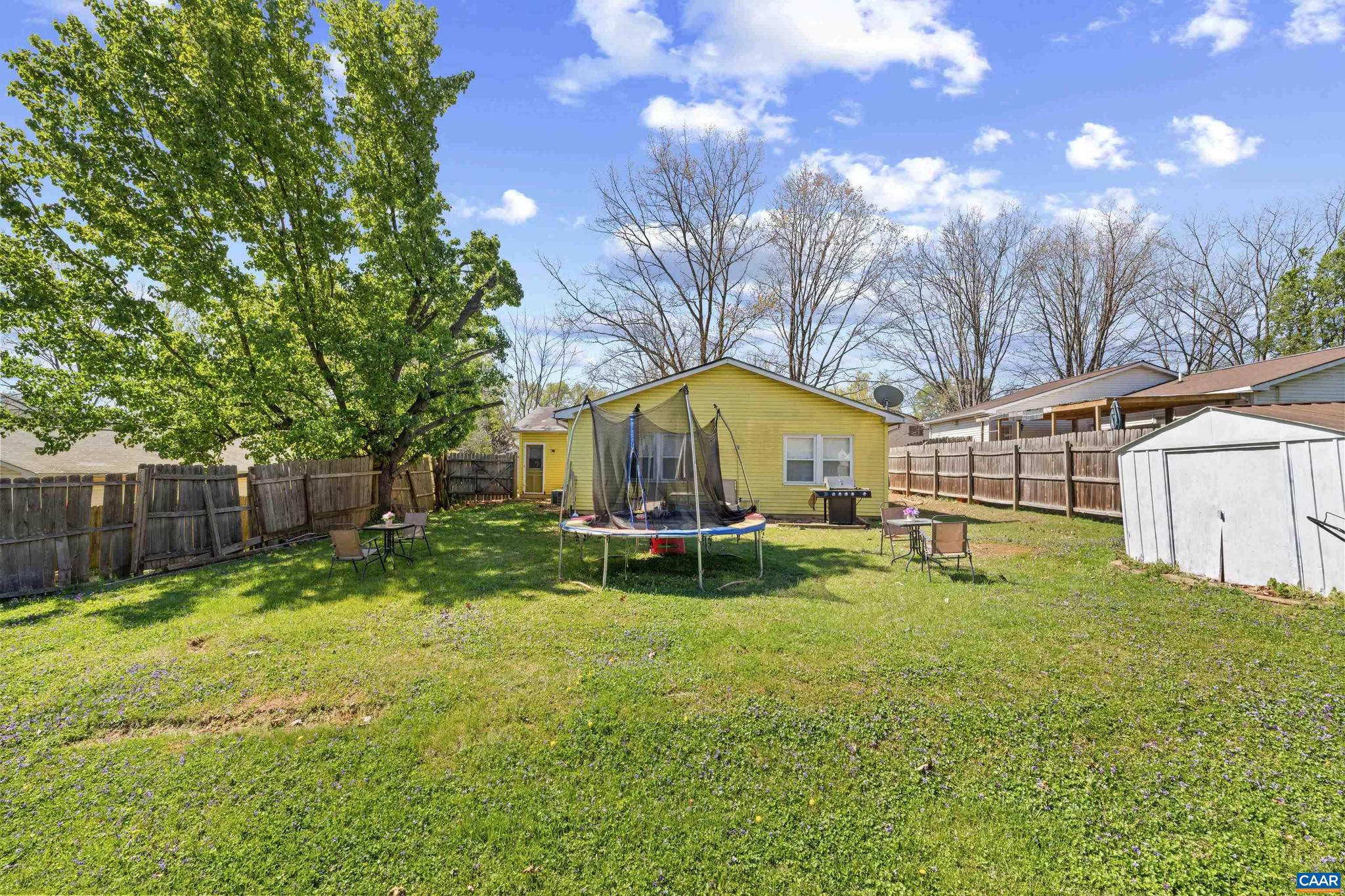 215 Dice Street Charlottesville, VA 22902 - Photo 40 of 52 a view of backyard with table and chairs and wooden fence