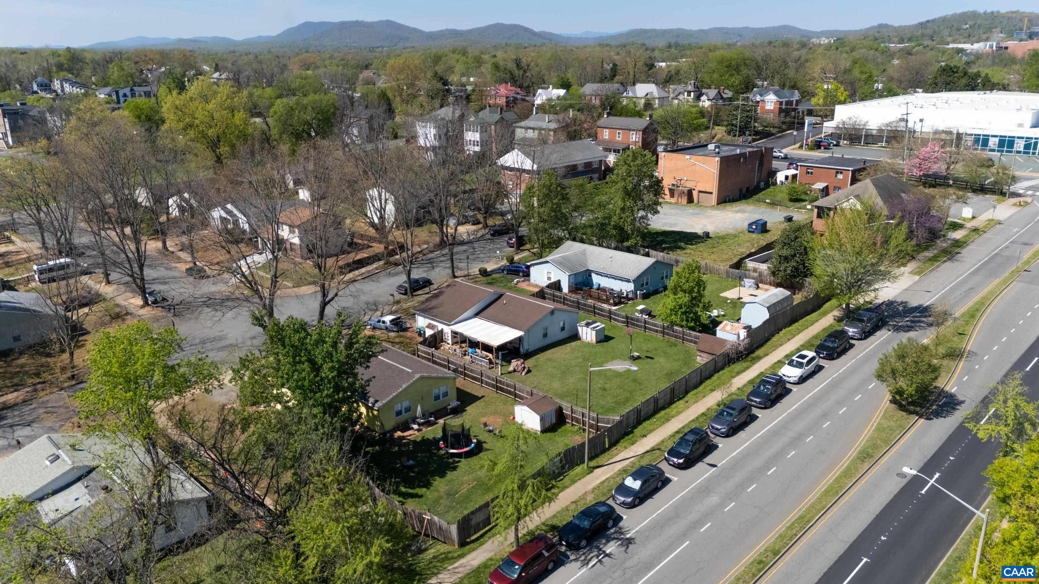 215 Dice Street Charlottesville, VA 22902 - Photo 47 of 52 an aerial view of a city with lots of residential buildings and mountain view in back