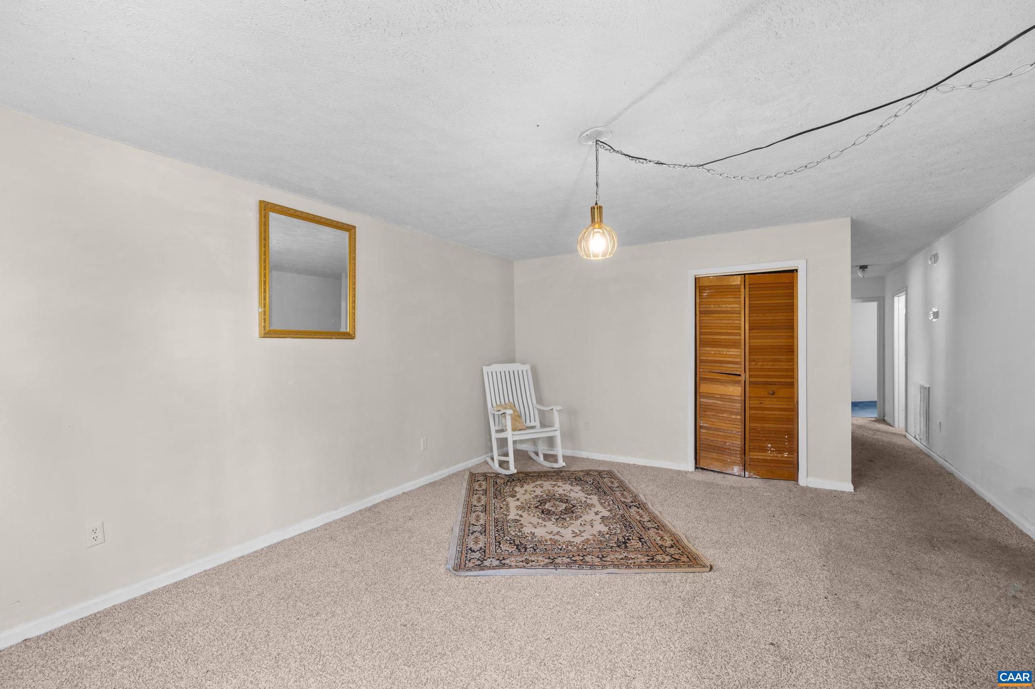 215 Dice Street Charlottesville, VA 22902 - Photo 10 of 52 a bedroom with a bed and a painting on the wall
