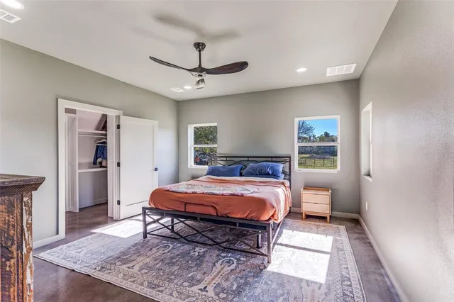 a bed room with a bed and a chandelier