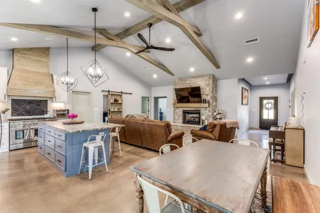 a living room with fireplace furniture and a flat screen tv