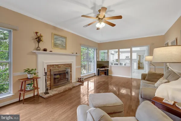 a view of a bedroom with a bed and a lamp on dresser